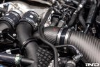 Eventuri BMW G90 G99 M5 S68 carbon turbo inlet set, matte finish, close-up view of installed performance inlet system.