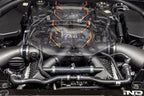 Eventuri BMW G90 G99 M5 S68 carbon turbo inlet set with matte finish and exposed cover installed on engine.