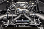 Eventuri BMW G90 G99 M5 S68 carbon turbo inlet set installed, showcasing matte finish and performance-focused design.