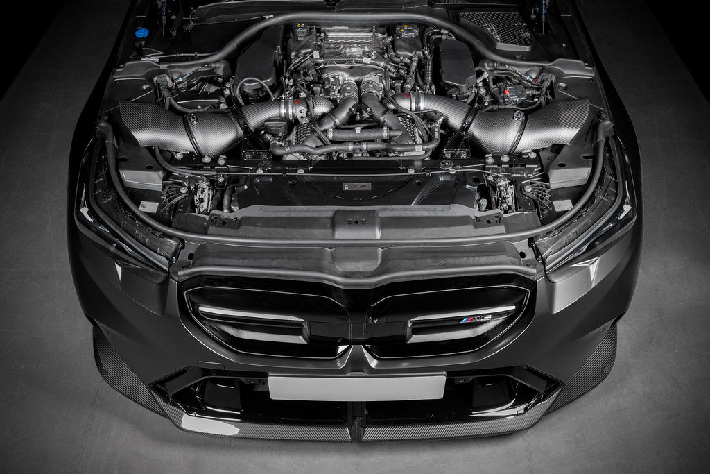 Eventuri BMW G90 G99 M5 S68 carbon turbo inlet set installed, showcasing matte black performance inlet components.