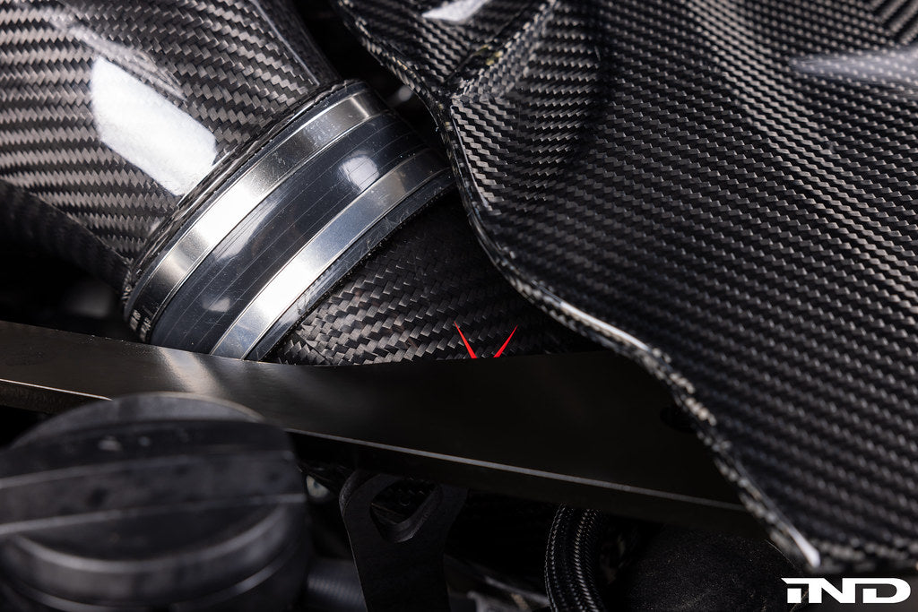Close-up of Eventuri carbon turbo inlet set for F9X X5M, X6M, G09 XM, M60i LCI showing connectors and high-performance build.