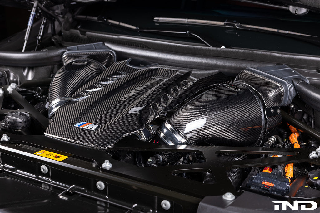 Eventuri F9X X5M X6M G09 XM M60i LCI carbon turbo inlet set installed on engine, showcasing performance intake components.