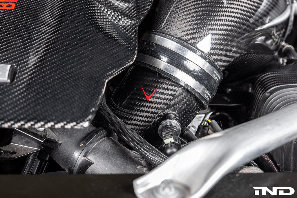 Close-up view of Eventuri's LCI BMW S68 carbon turbo inlets installed with carbon intake system.