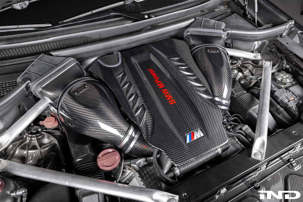 Eventuri carbon turbo inlet set installed on BMW F9X X5M, X6M, G09 XM, and M60i LCI performance vehicles, showcasing sleek carbon design