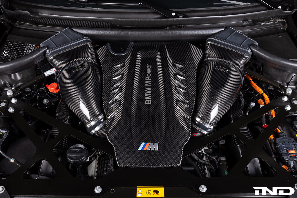 Eventuri carbon turbo inlet set installed on BMW F9X X5M, X6M, G09 XM, and M60i LCI models, showcasing performance upgrade components.