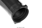 Close-up of Eventuri Ferrari F12 Berlinetta carbon intake system flange showing high-performance carbon fiber details.