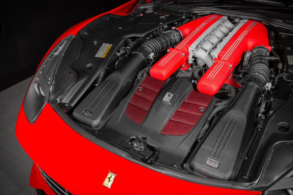 Eventuri Ferrari F12 Berlinetta carbon intake system installed, showcasing the sleek carbon fiber design and performance enhancement features.