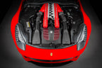 Eventuri carbon intake system installed in front of a Ferrari F12 Berlinetta, showcasing performance air intake components.
