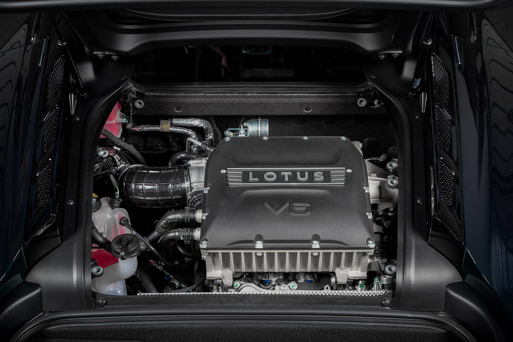 Eventuri Lotus Emira V6 black carbon intake system installed, showcasing sleek performance-oriented engine airflow components.