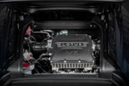 Eventuri Lotus Emira V6 black carbon intake system installed, showcasing sleek performance-oriented engine airflow components.