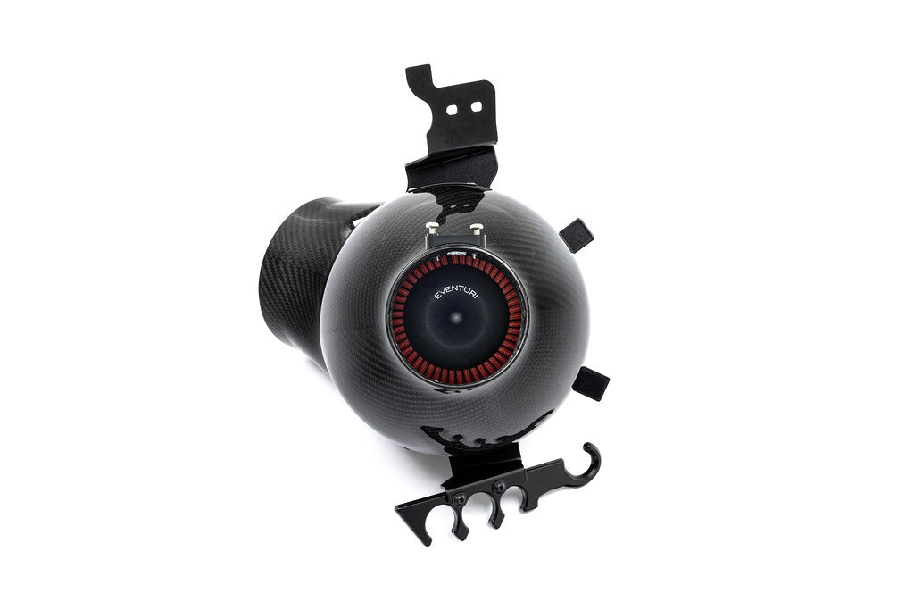 Eventuri Lotus Emira V6 black carbon intake system with sleek design, showcasing performance-oriented components on a white background.