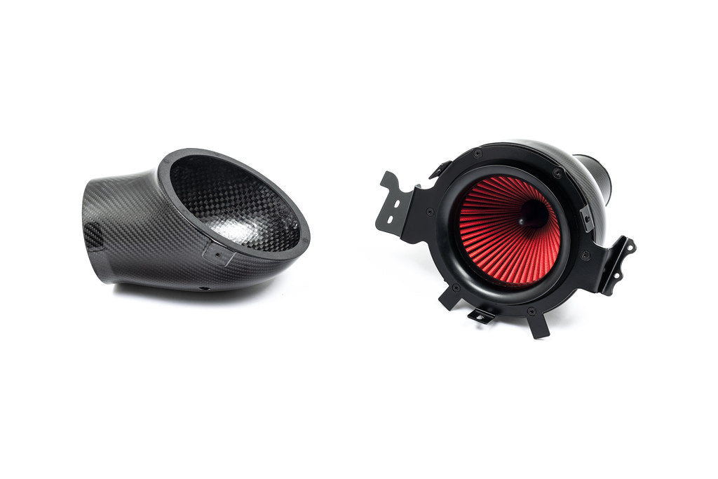 Eventuri Lotus Emira V6 black carbon intake system, high-performance automotive part with sleek design on white background.