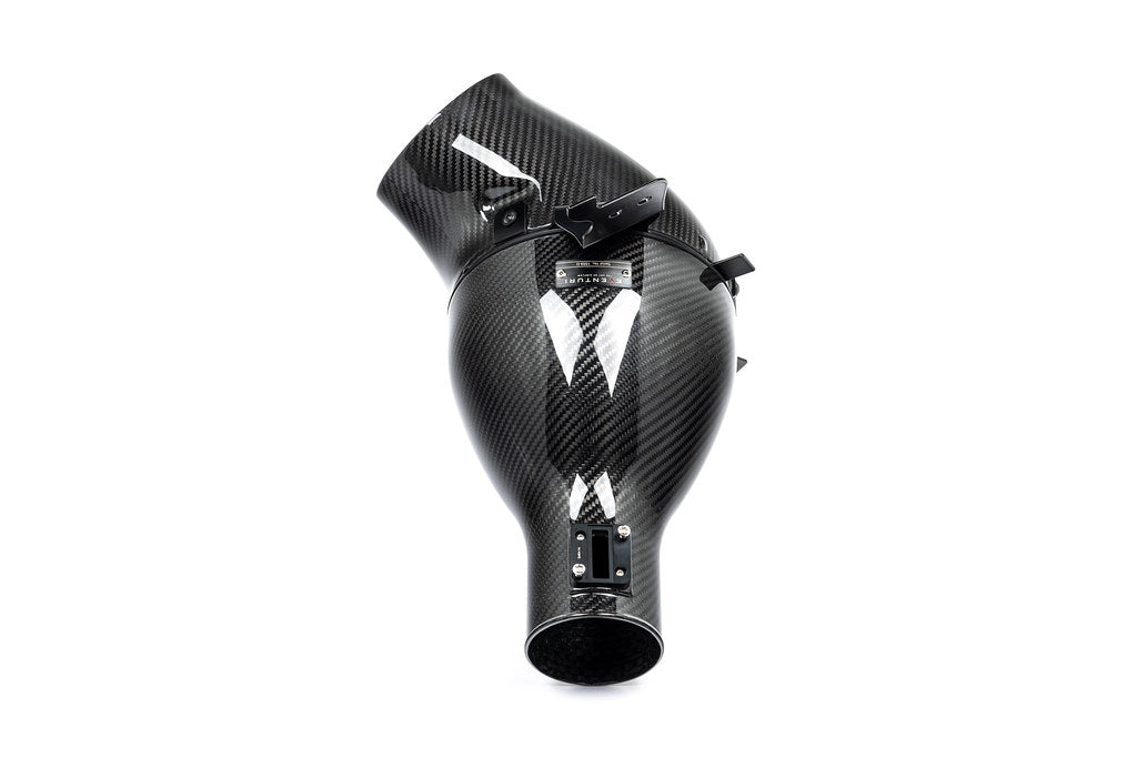 Eventuri Lotus Emira V6 black carbon intake system showcasing sleek design and high-performance materials on a white background.