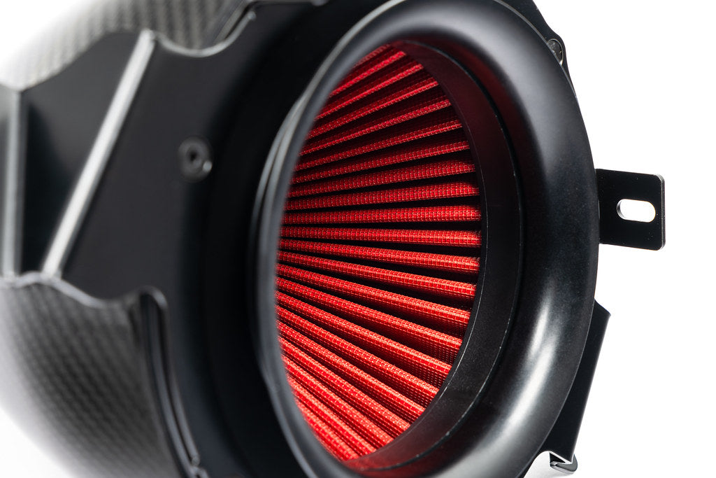 Eventuri Lotus Emira V6 black carbon intake system installed, showcasing a sleek performance air intake for enhanced engine airflow.