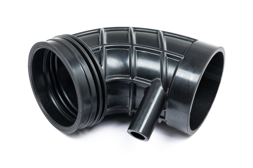Eventuri Lotus Emira V6 black carbon intake system with sleek design, performance-oriented, shown against a white background.