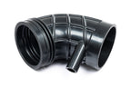 Eventuri Lotus Emira V6 black carbon intake system with sleek design, performance-oriented, shown against a white background.