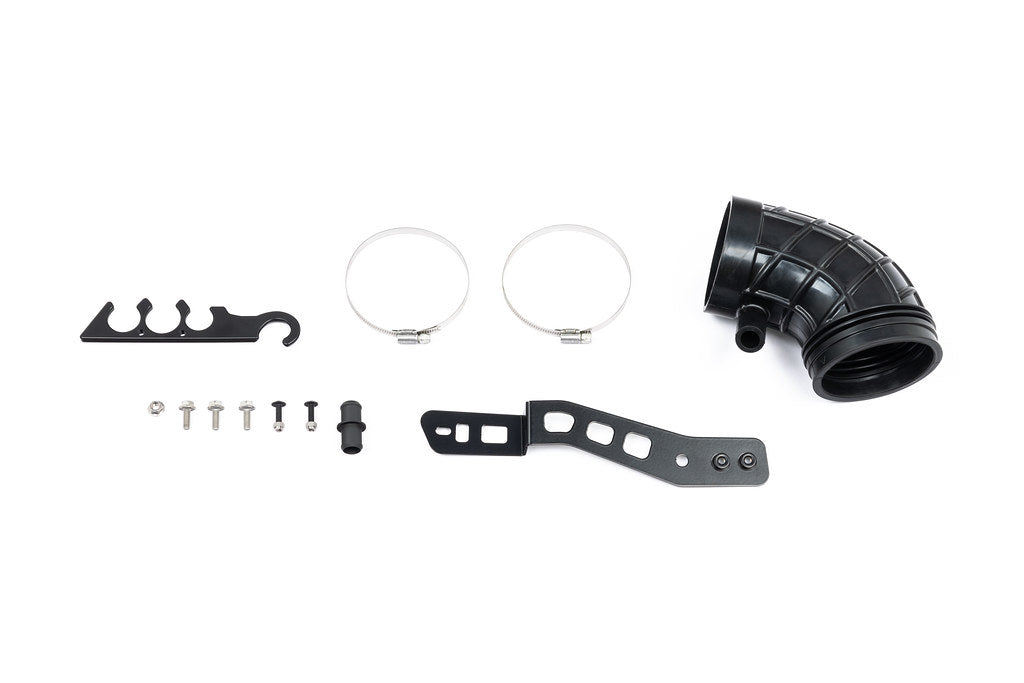 Eventuri Lotus Emira V6 black carbon intake system shown on white background, showcasing sleek performance air intake for the Lotus Emira.