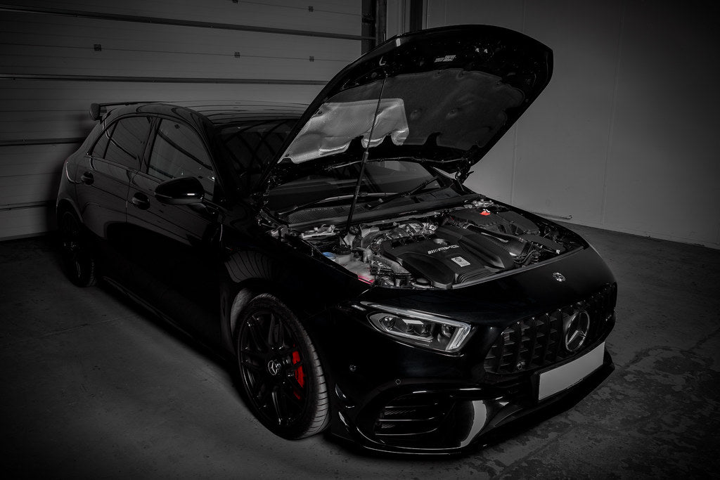Eventuri black carbon intake system installed in a Mercedes AMG A45 and CLA45, showcasing high-performance automotive parts.
