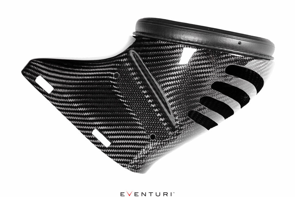 Image showing the carbon duct from Eventuri's Mercedes AMG A45 / CLA45 Intake System, featuring cut-outs for ECU ventilation against a white background.