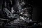 Eventuri black carbon intake system installed on Mercedes AMG A45 and CLA45 performance vehicle, showcasing sleek design and high-quality materials.