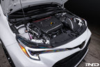 Eventuri gloss carbon intake system for Toyota GR Corolla G16E engine, performance air intake on white background