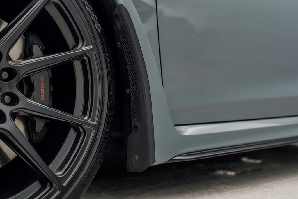 Megachip FL5 Civic Type-R splash guard set installed on the exterior of the car, showing black protective mud flaps and mounting hardware.