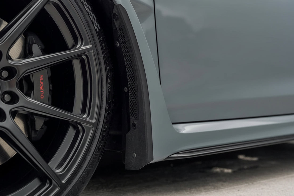 Megachip FL5 Civic Type-R splash guard set installed on the exterior of the car, showing black protective mud flaps and mounting hardware.