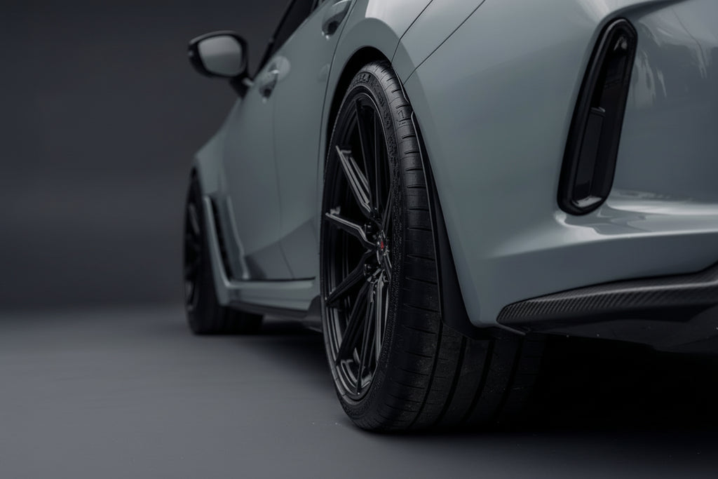 Megachip FL5 Civic Type-R splash guard set installed on the car's wheel arches, showcasing durable exterior protection.