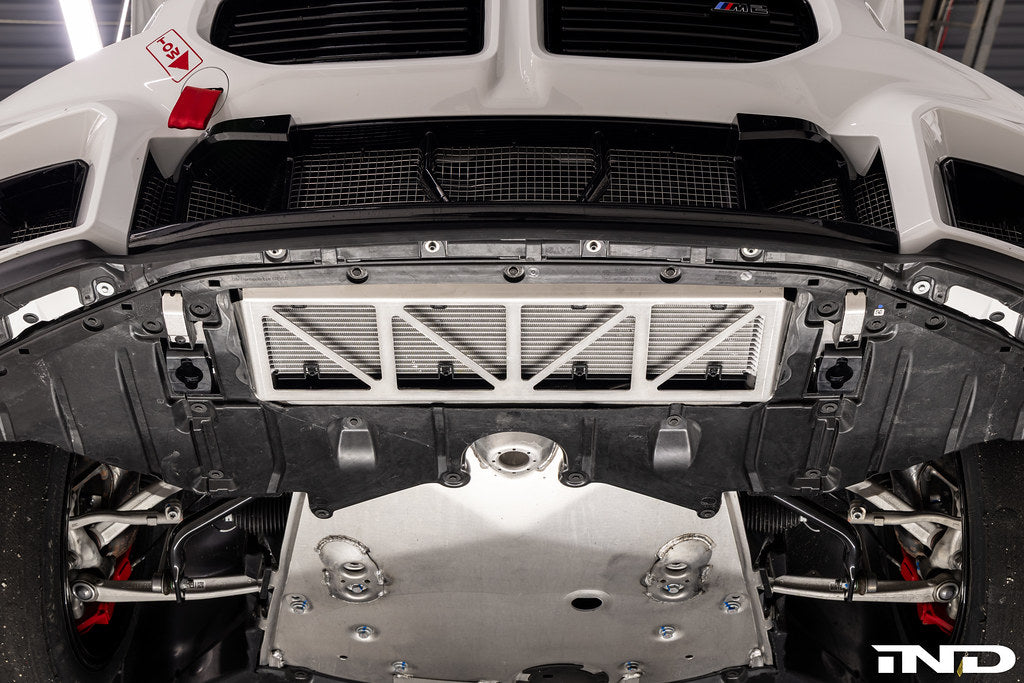 Fall-Line Motorsports oil cooler guard installed on BMW G8X M2, M3, and M4 models, designed to protect the factory oil cooler from road and track debris while maintaining airflow and fitment.