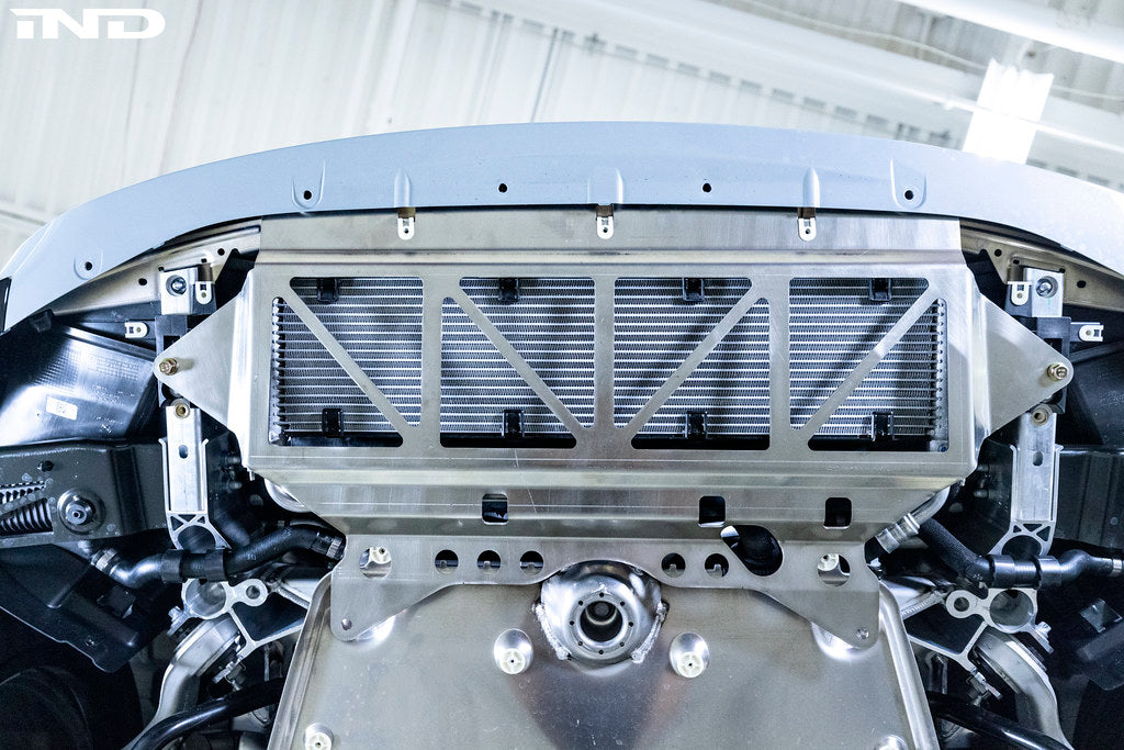 Fall-Line Motorsports oil cooler guard installed on BMW G8X M2, M3, and M4 models, designed to protect the factory oil cooler from road and track debris while maintaining airflow and fitment.