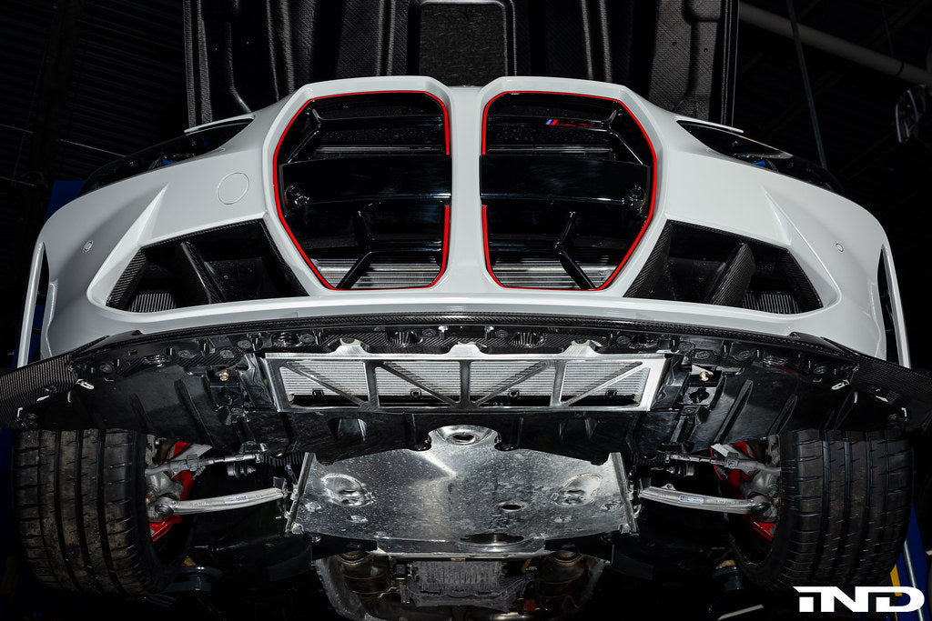 Fall-Line Motorsports oil cooler guard installed on BMW G8X M2, M3, and M4 models, designed to protect the factory oil cooler from road and track debris while maintaining airflow and fitment.