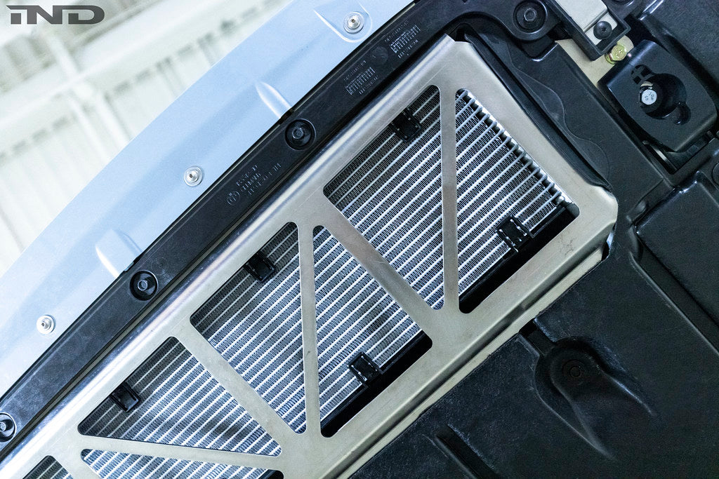 Fall-Line Motorsports oil cooler guard installed on BMW G8X M2, M3, and M4 models, designed to protect the factory oil cooler from road and track debris while maintaining airflow and fitment.