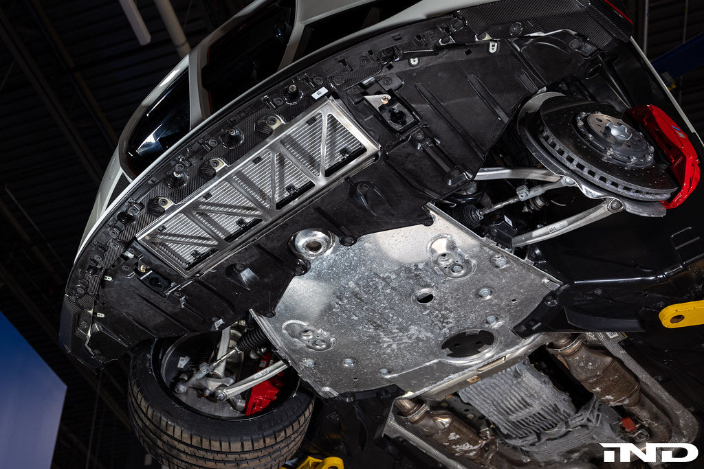 Fall-Line Motorsports oil cooler guard installed on BMW G8X platform vehicles, including the G87 M2, G80 M3, and M4 CSL, providing additional protection for the factory oil cooler while maintaining proper airflow and OEM-style fitment.