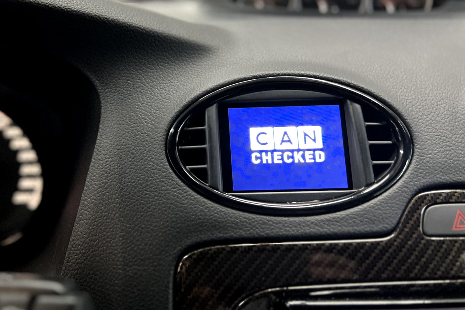 CANchecked MFD28 Gen2 2.8-inch multi-function display installed in a Ford MK2 Focus, compatible with left-hand drive and right-hand drive models, featuring a vehicle-specific dashboard integration.