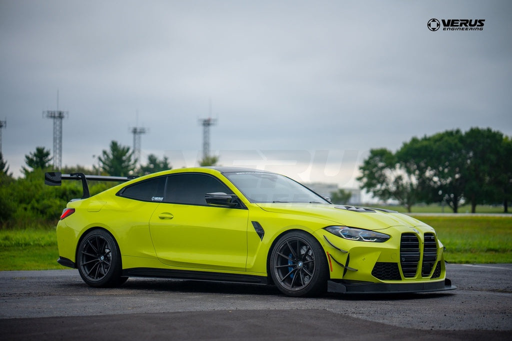 Verus Engineering G8x M3 M4 carbon polyweave front splitter kit installed on BMW M4, showcasing sleek aerodynamic exterior design.