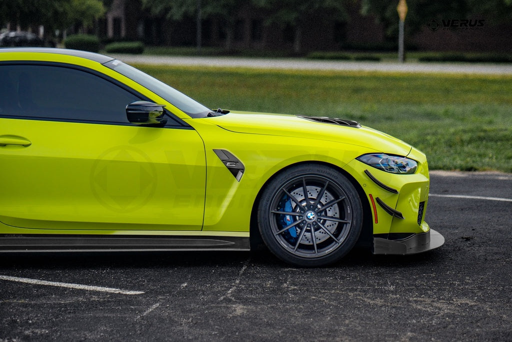 Verus Engineering G8x M3 M4 Carbon Polyweave Front Splitter Kit installed on a BMW M4, showcasing the sleek exterior design.