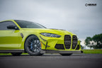 Verus Engineering G8x M3 M4 carbon polyweave front splitter kit installed on a BMW M4, showcasing sporty exterior design.