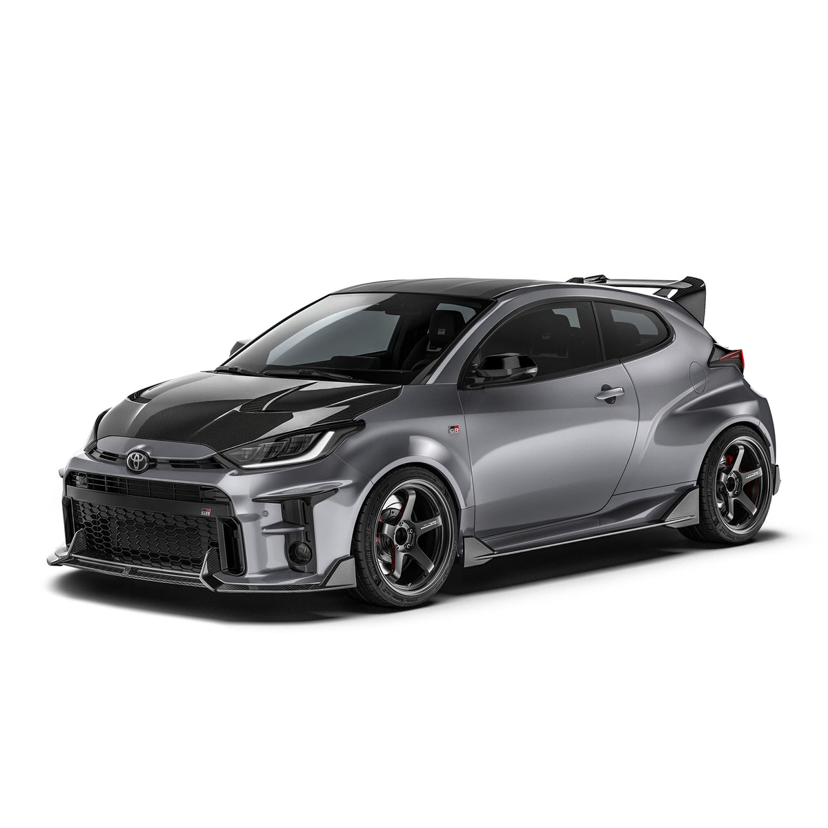 ADRO Toyota GR Yaris exterior carbon fiber side skirts installed on the vehicle, showcasing a sleek, aerodynamic design.