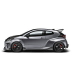 ADRO Toyota GR Yaris carbon fiber side skirts installed on exterior of vehicle, showcasing sleek, aerodynamic design.