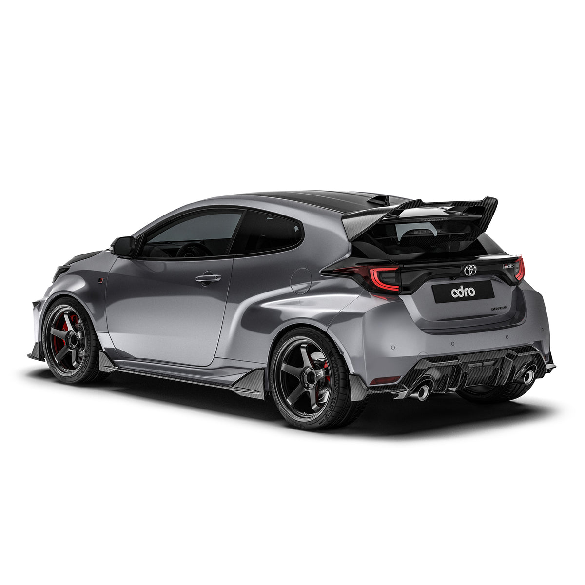ADRO Toyota GR Yaris carbon fiber side skirts installed on the vehicle's exterior, showcasing a sleek and sporty design.
