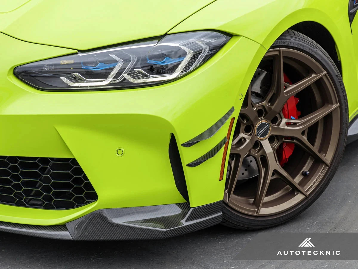 AutoTecknic G8X M3 M4 dry carbon canard set installed on exterior of a car, showcasing lightweight aerodynamic design.