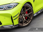 AutoTecknic G8X M3 M4 dry carbon canard set installed on exterior of car, showcasing aerodynamic performance and sleek design.