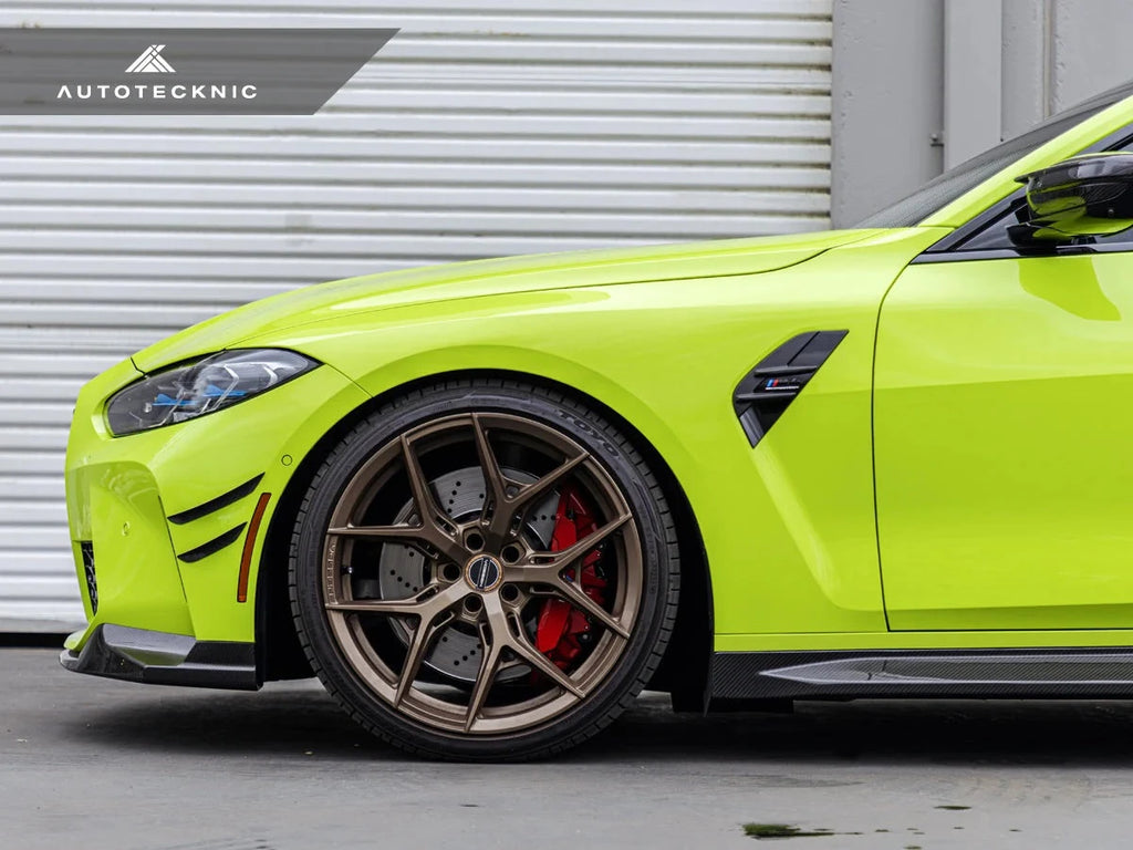 AutoTecknic G8X M3/M4 dry carbon canard set mounted on a vehicle's exterior, showcasing lightweight aerodynamic design.
