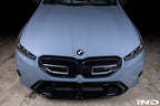 IND Carbon BMW Roundel Set installed on a BMW showing hand-laid carbon fiber details, gloss black surrounds, and OEM fitment appearance