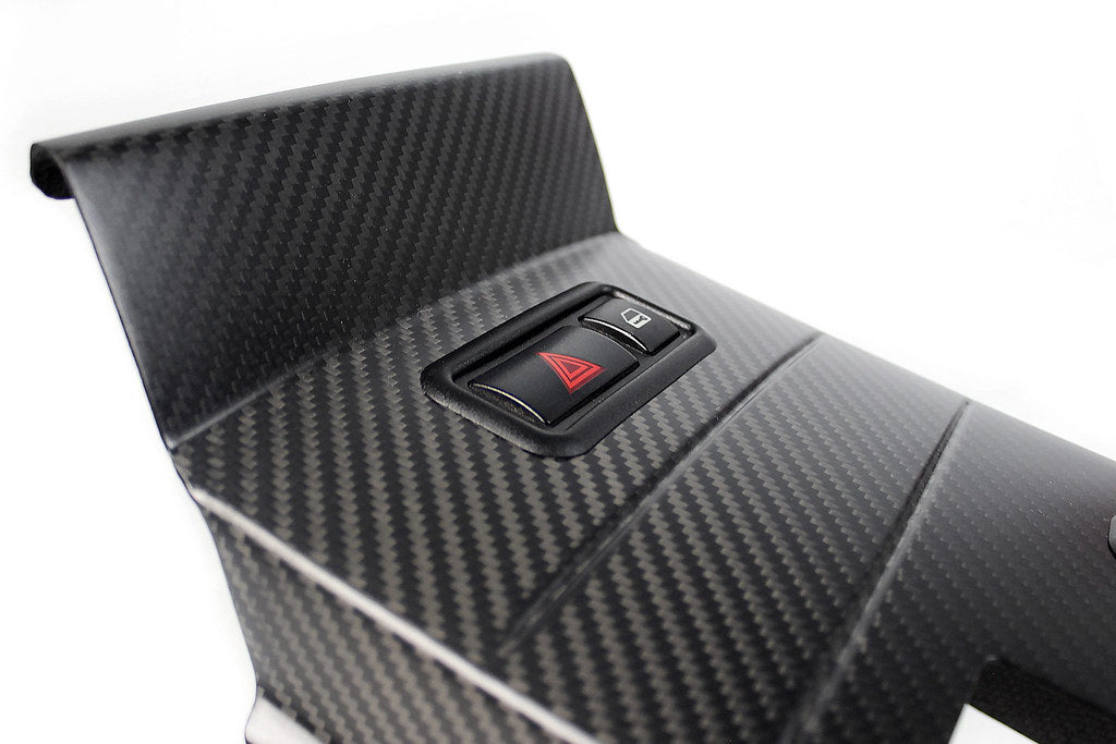 IND E46 M3 CSL center console trim kit with hazard switch frame installed inside the vehicle's interior.