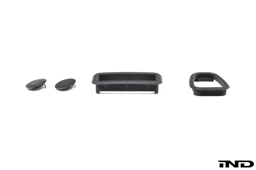 Interior image of IND E46 M3 CSL center console trim kit showing sleek, carbon fiber accents on the vehicle's center console.