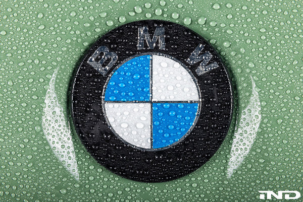IND Painted BMW Roundel Installed on Green BMW Showing Water Beading and Ceramic Coating Protection for Enhanced Gloss and Easier Maintenance