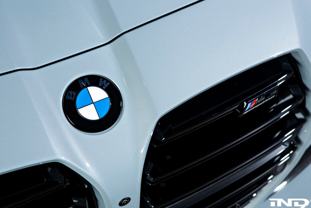 Exterior IND Painted BMW Roundel Set showing sleek, painted BMW logos on a reflective surface.