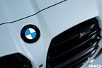 Exterior IND Painted BMW Roundel Set showing sleek, painted BMW logos on a reflective surface.