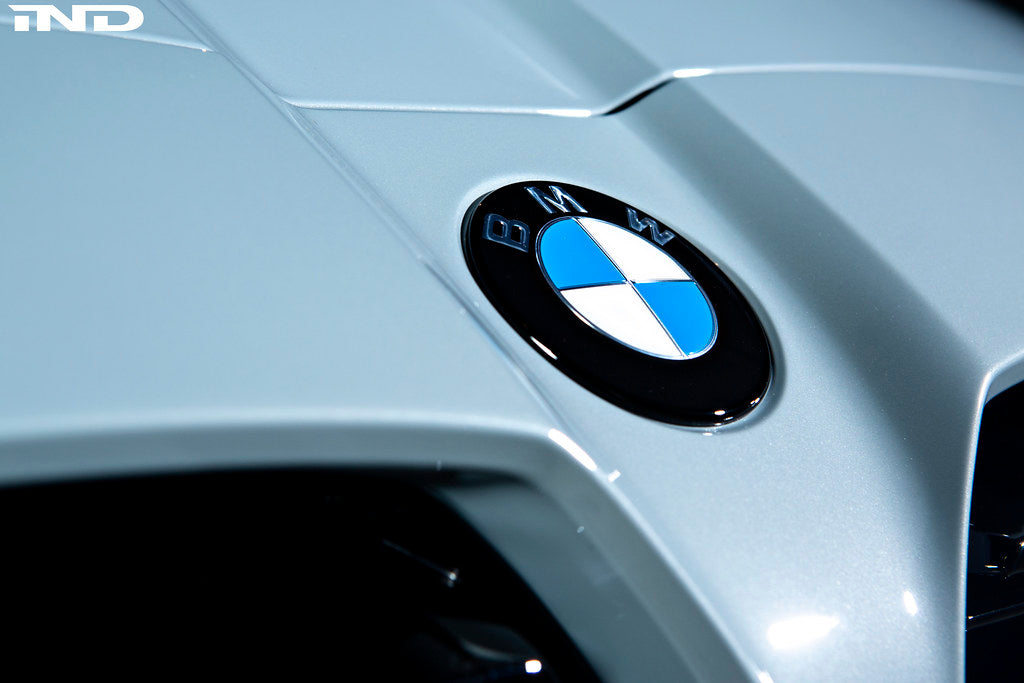 Exterior IND Painted BMW Roundel Set showing sleek, painted BMW logos on a reflective surface.